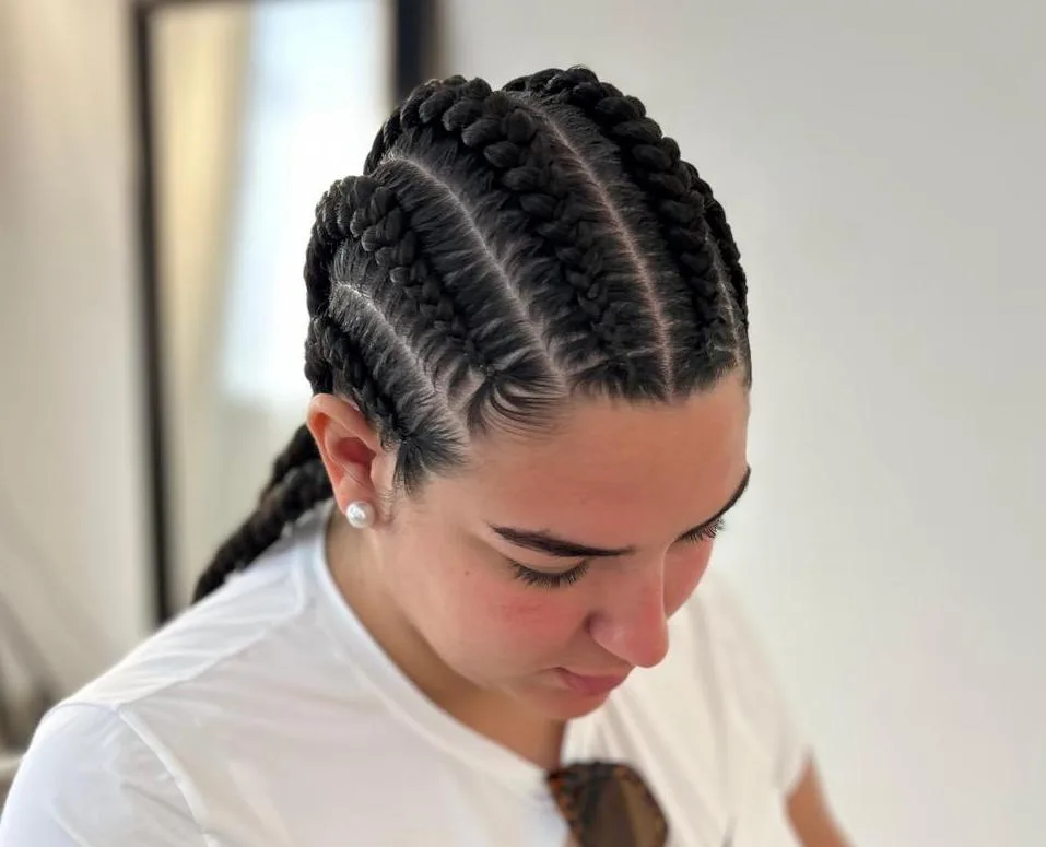 Overhead view of thick feed-in cornrows swept back from the hairline